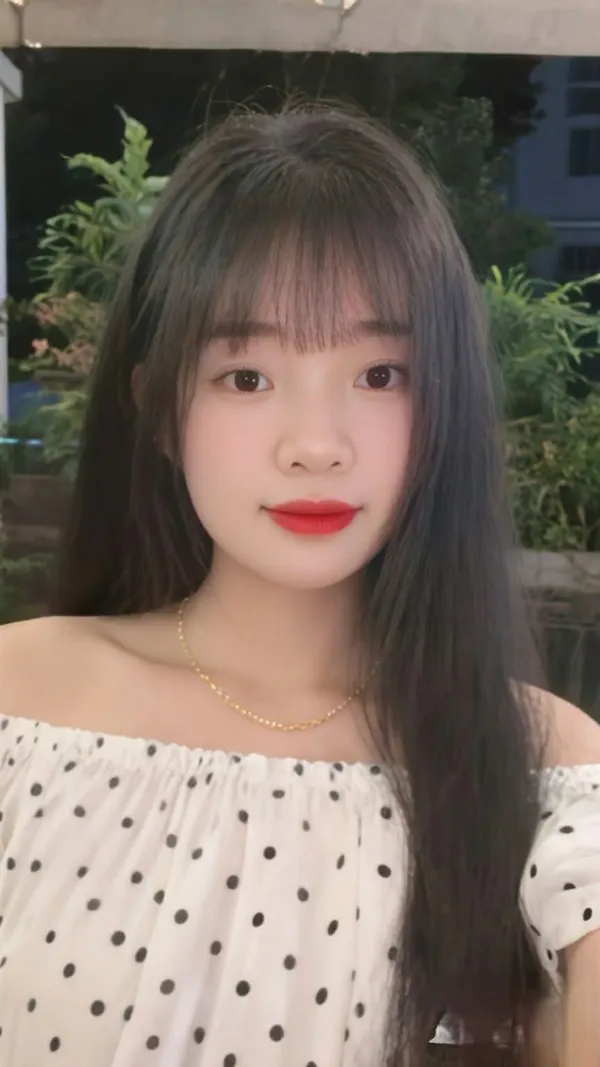 A person on an anonymous video chat call, plain background behind them